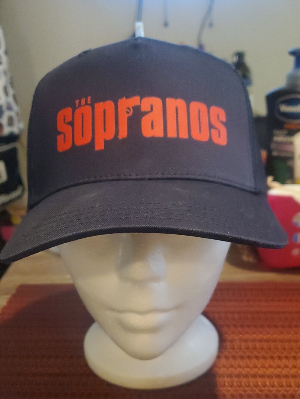 The Sopranos Navy Trucker Hat with Orange Logo